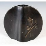 A Japanese bronze vase, 20th century, of flattened circular form, cast in relief with bamboo, 18.5cm