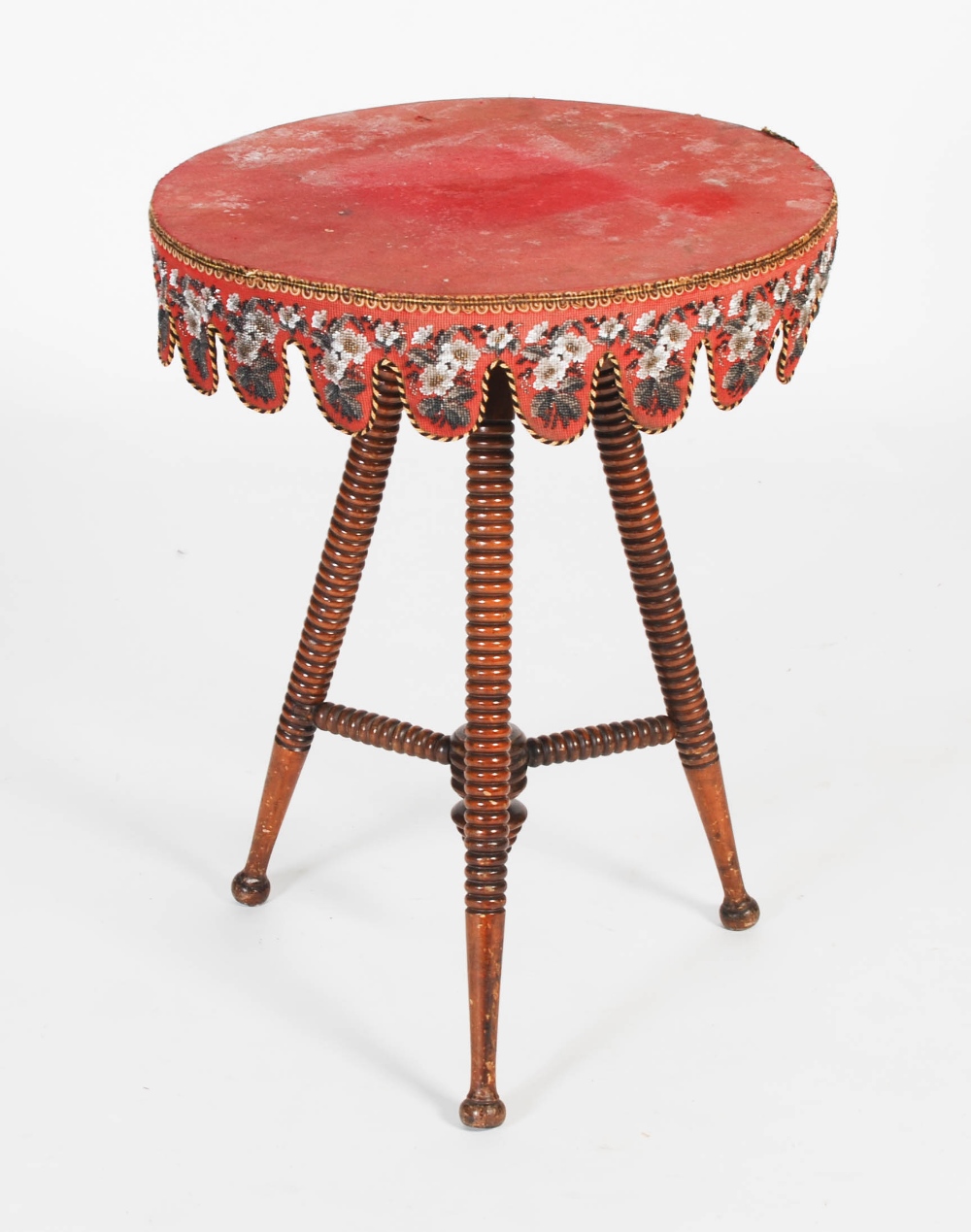 A Victorian mahogany bobbin-turned gypsy table, the round baize-lined top with a needlework and