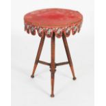 A Victorian mahogany bobbin-turned gypsy table, the round baize-lined top with a needlework and