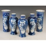 A Chinese porcelain blue and white five piece garniture, 20th century, decorated with oval shaped