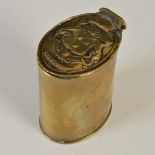 A 19th century brass upright oval snuff box, the hinged cover embossed with the coat-of-arms of