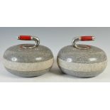 A pair of 20th century granite curling stones, 26.5cm diameter.