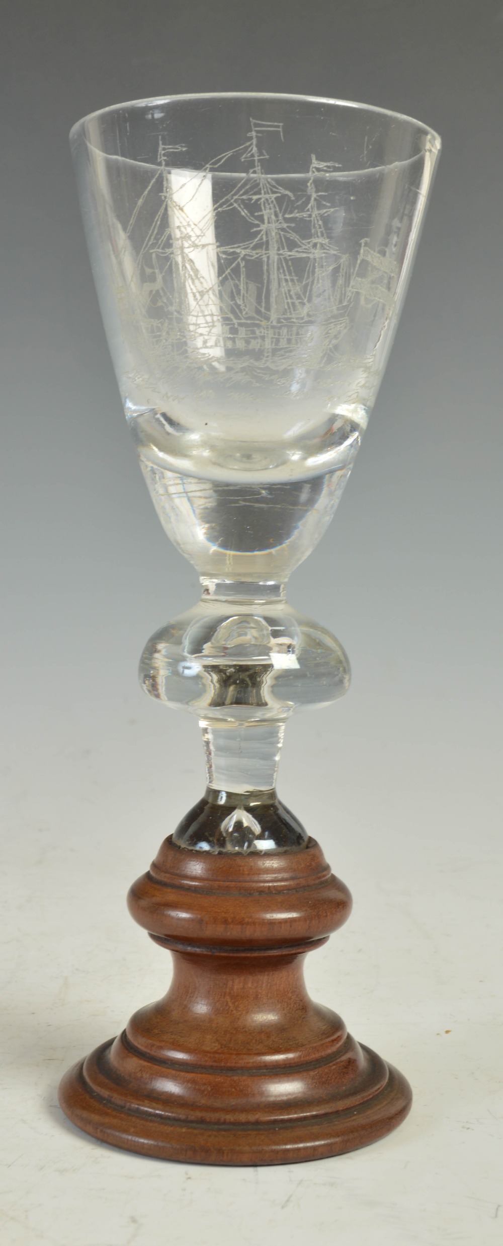 An 18th century Dutch wine glass or goblet, the conical shaped bowl with scratched/ engraved