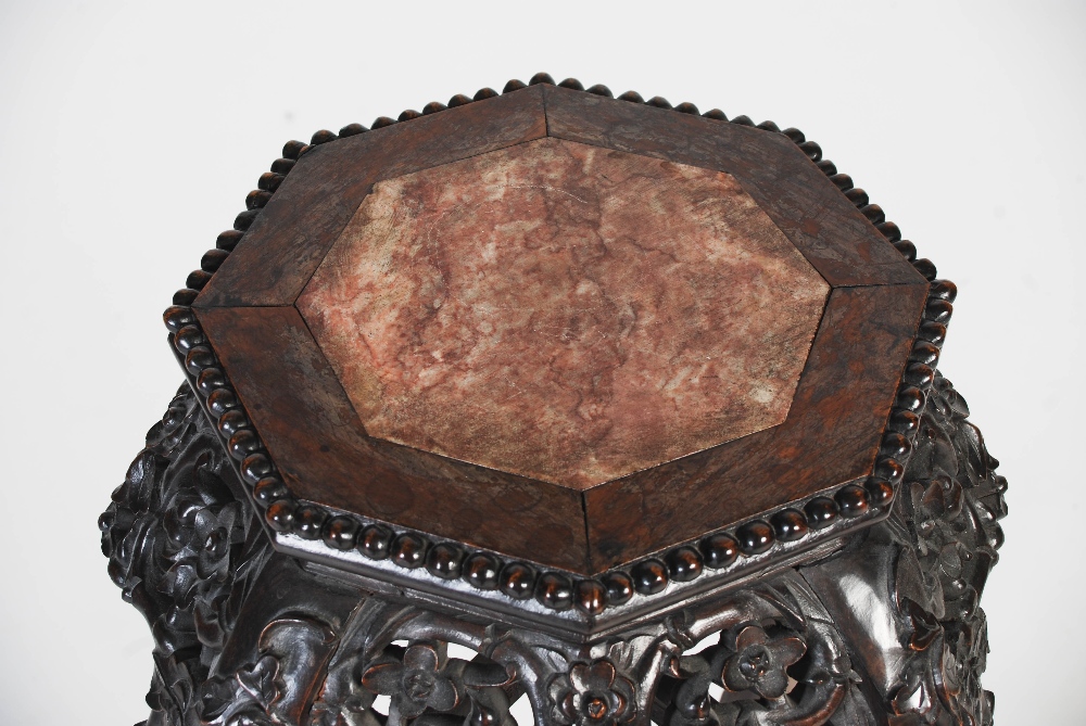 A Chinese darkwood jardiniere stand, Qing Dynasty, the octagonal top with a marble insert above a - Image 2 of 6