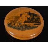 A 19th century Mauchline ware penwork circular snuff box, with a depiction of Edinburgh Castle and