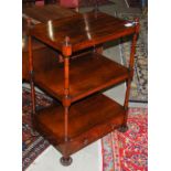 A 19th century rosewood whatnot, with three open shelves and single drawer, on four graduated bun