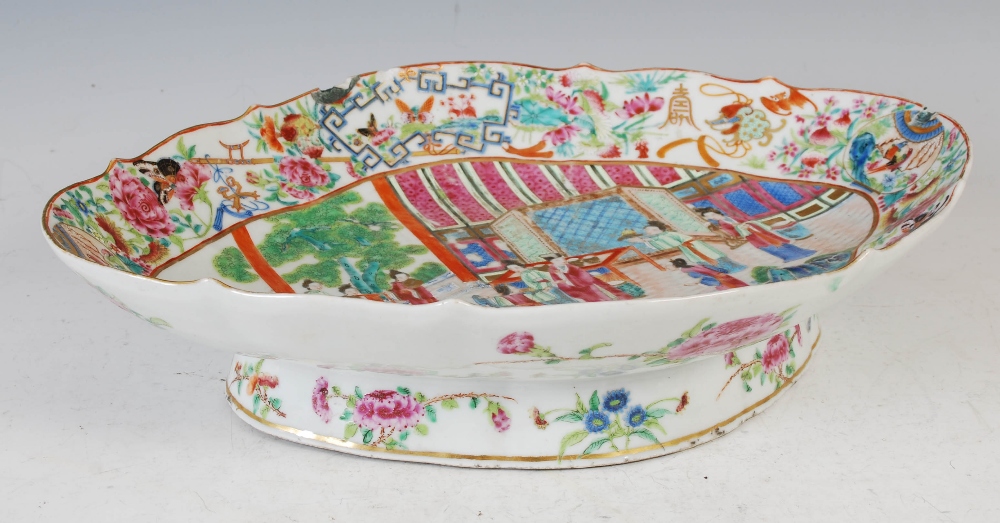 A Chinese porcelain famille rose canton lozenge shaped dish, Qing Dynasty, decorated with Court