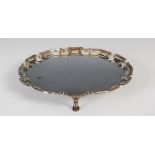 A George V silver salver, Birmingham, 1935, makers mark of A.S, of shaped circular form, raised on