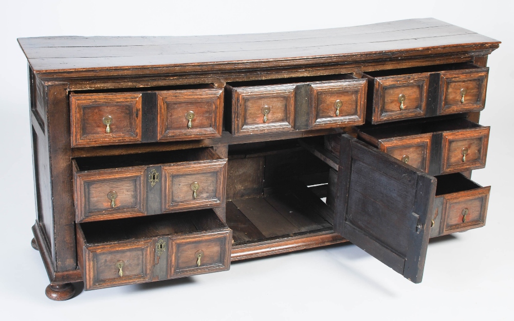 An 18th century oak dresser, the rectangular planked top above three frieze drawers and central - Image 4 of 9