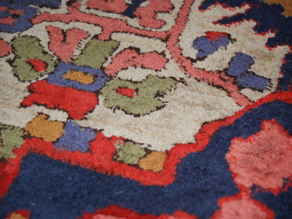 A Persian rug, 20th century, the rectangular field centred with a blue ground medallion within a - Image 6 of 6