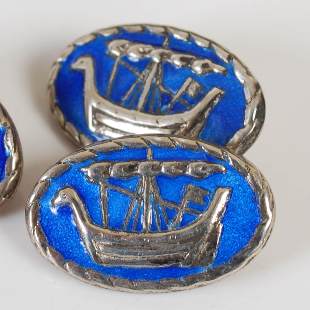 A pair of silver and blue enamel cufflinks after a design by Alexander Ritchie, the oval shaped - Image 2 of 3