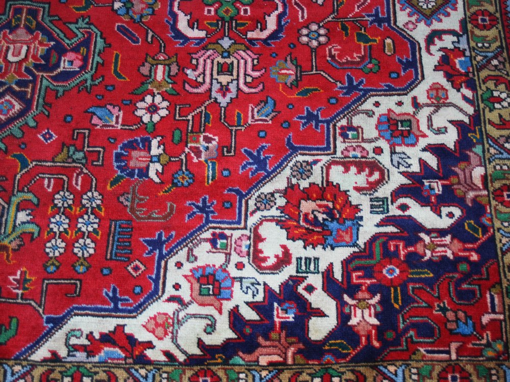 A Persian Carpet, Tabriz, 20th century, the rectangular madder ground centred with a blue - Image 5 of 6