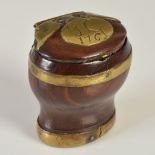 A mid 18th century Scottish lignum vitae baluster snuff mull, with brass mounts and butterfly hinge,