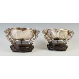 A pair of late 19th century Chinese silver tripod bowls, WANG HING, of shaped hexagonal form with