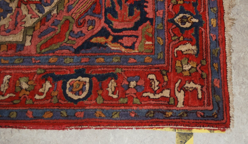 A Persian rug, 20th century, the rectangular field centred with a blue ground medallion within a - Image 2 of 6