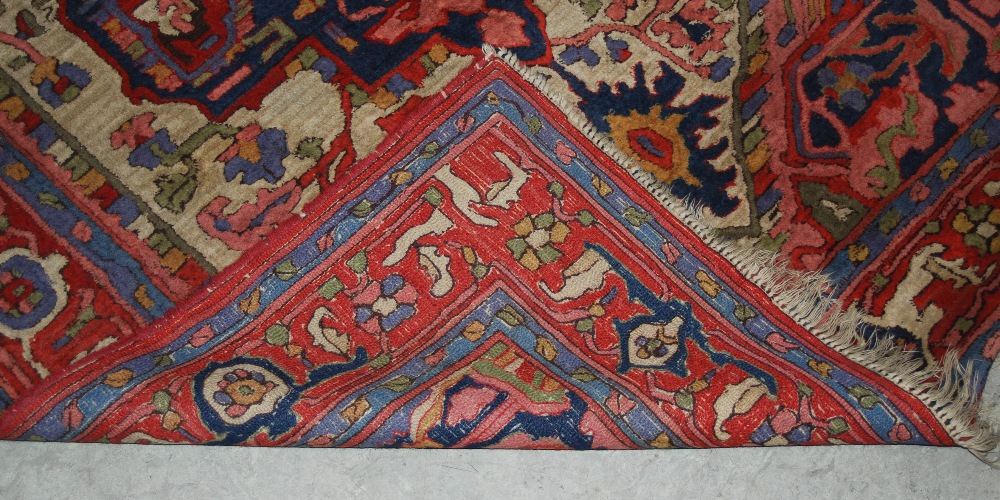 A Persian rug, 20th century, the rectangular field centred with a blue ground medallion within a - Image 3 of 6