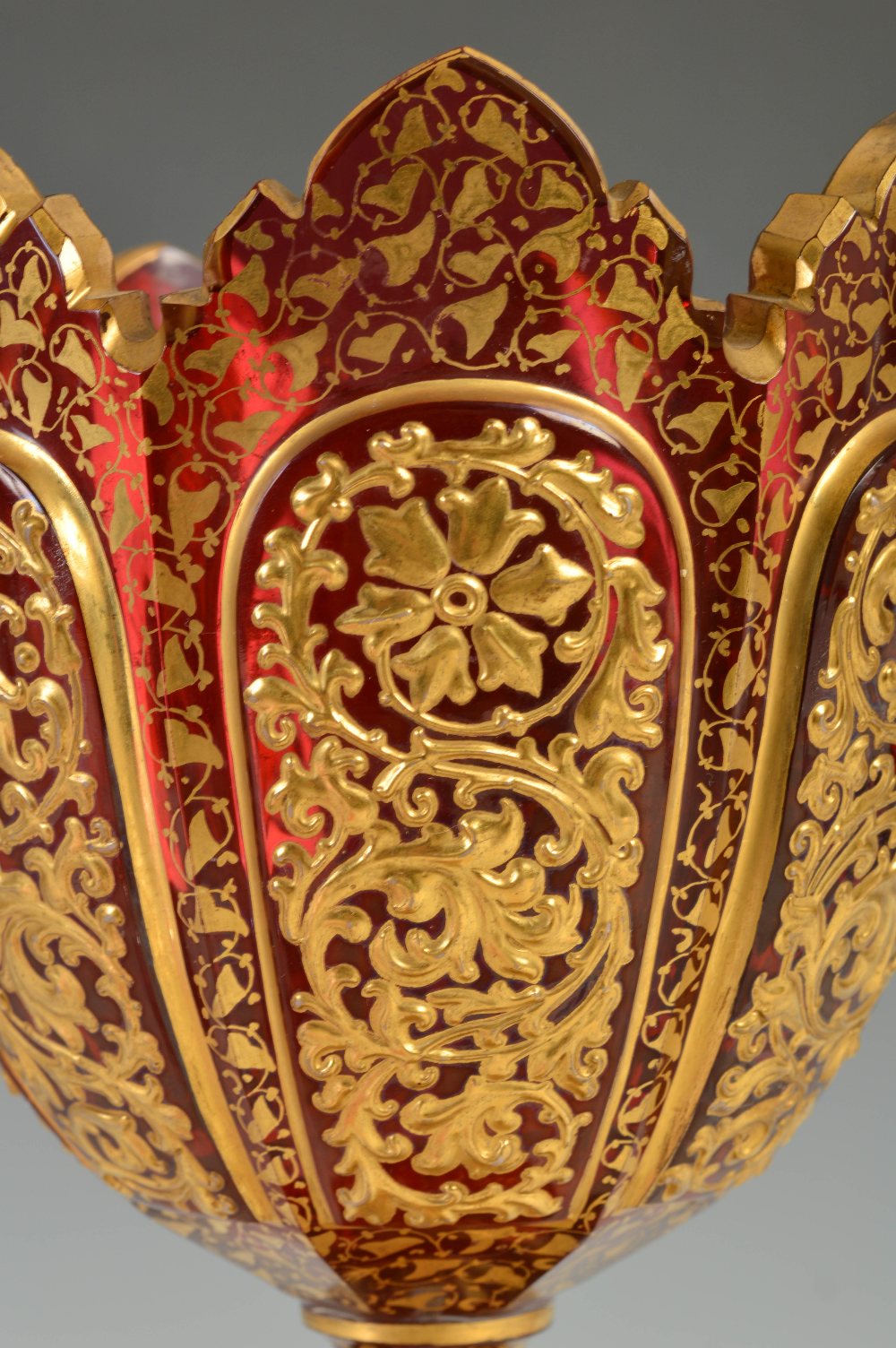 A late 19th century Bohemian ruby glass goblet, decorated in relief with panels of flowers and - Image 3 of 6