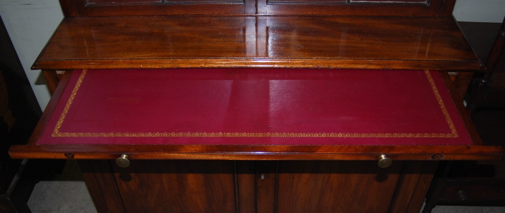 A 19th century mahogany bookcase, the moulded cornice above a pair of astragal glazed cupboard doors - Image 4 of 4