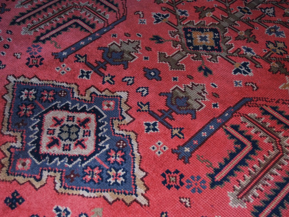 A late 19th/ early 20th century Ushak carpet, the madder ground decorated with flowers and - Image 6 of 8