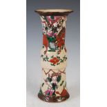 A Chinese porcelain crackle glazed gu shaped vase, Qing Dynasty, decorated with warriors, incised