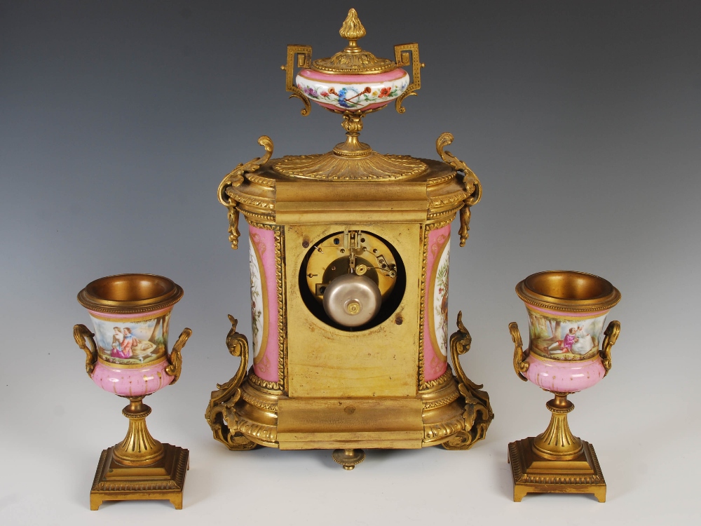 A 19th century ormolu and pink ground porcelain mounted clock garniture, the porcelain dial - Image 6 of 9