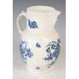 An 18th century Worcester blue and white cabbage leaf mask jug, decorated with scattered foliate