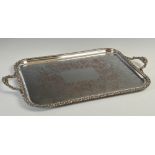 A large two-handled EP oblong serving tray with foliate border, 68.5cm x 41cm