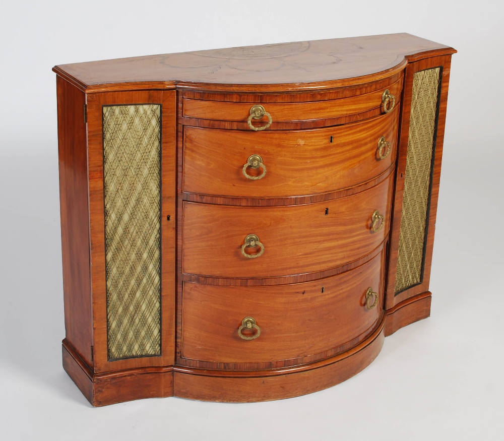 A 19th century mahogany and marquetry inlaid bowfront side cabinet, the shaped top with Neoclassical
