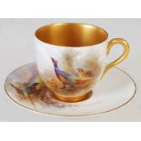 A Royal Worcester coffee cup and saucer decorated by James Stinton, dated 1912, hand painted with