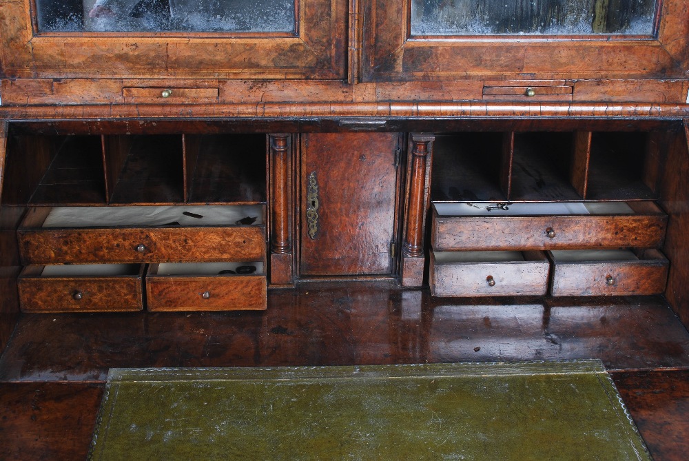 A George III walnut bureau bookcase, the moulded cornice above a pair of mirrored cupboard doors, - Image 8 of 14