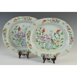 A pair of Chinese porcelain famille rose oval shaped dishes, Qing Dynasty, decorated with peonies