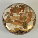 A Japanese blue ground Satsuma pottery circular shaped box and cover, Meiji Period, decorated with a