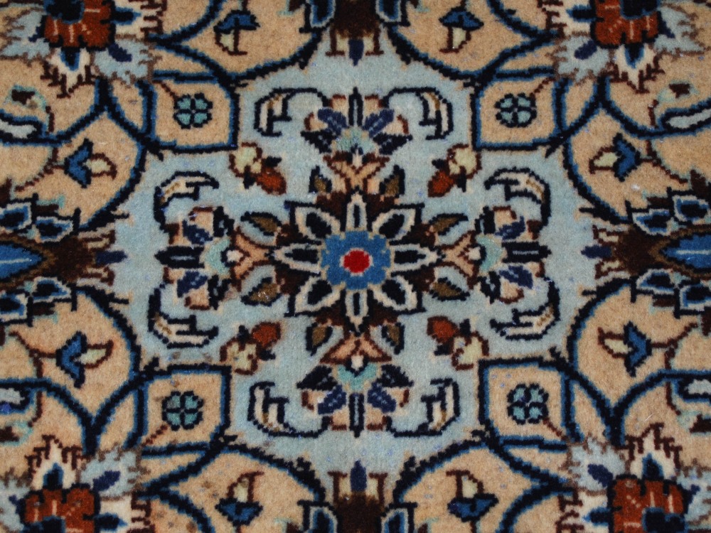 A Persian rug, Kashan, 20th century, the ivory ground decorated with all-over design of scrolling - Image 7 of 8