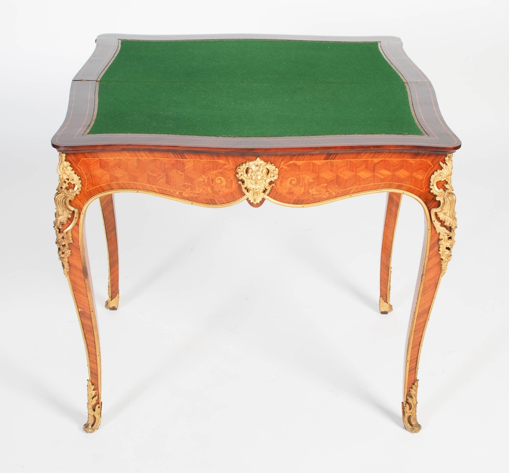 A late 19th/ early 20th century rosewood, parquetry and gilt metal mounted games/ card table, the - Image 5 of 7