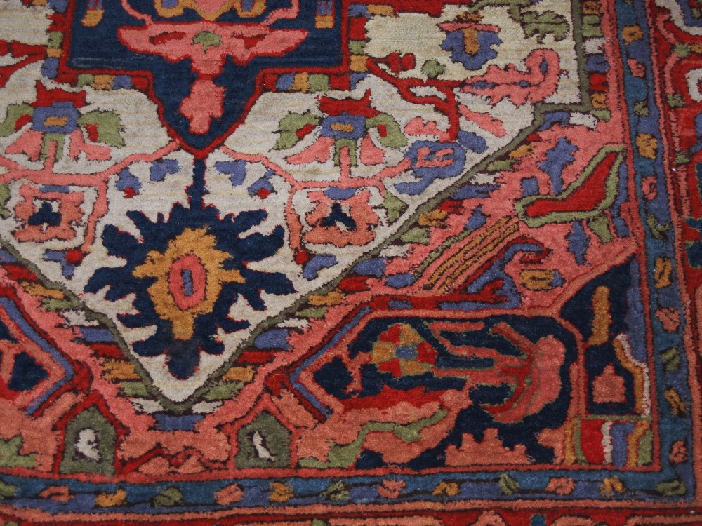 A Persian rug, 20th century, the rectangular field centred with a blue ground medallion within a - Image 5 of 6