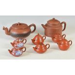 A collection of ten Chinese Yixing teapots, comprising; a plain cylindrical teapot with short