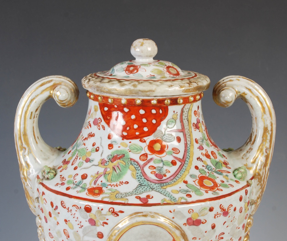 A Chinese porcelain twin-handled urn and cover, Qing Dynasty, decorated with two oval shaped - Image 5 of 10
