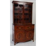 A 19th century mahogany, ebony and boxwood lined secretaire bookcase, the moulded cornice above a