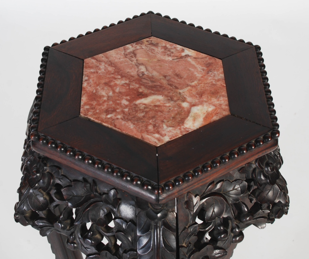 A Chinese darkwood jardiniere stand, Qing Dynasty, the hexagonal top with a marble insert above a - Image 2 of 5