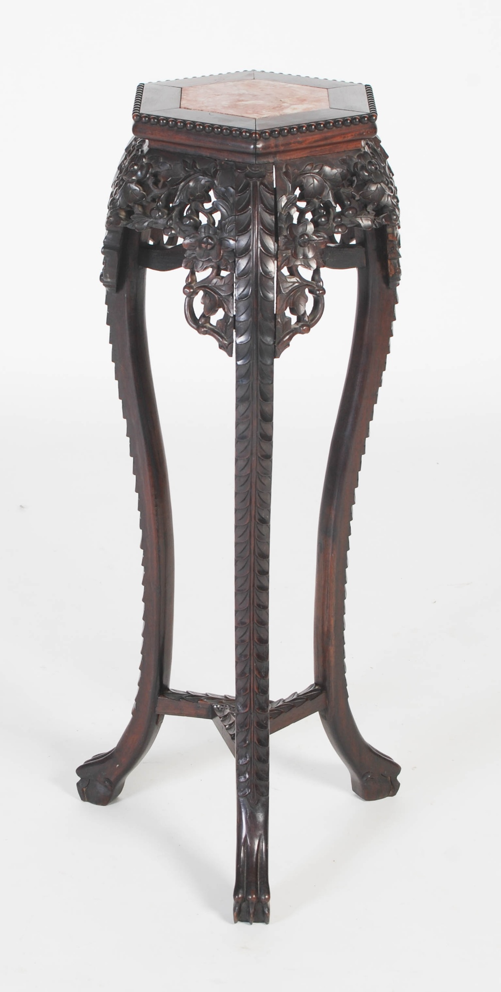 A Chinese darkwood jardiniere stand, Qing Dynasty, the hexagonal top with a marble insert above a