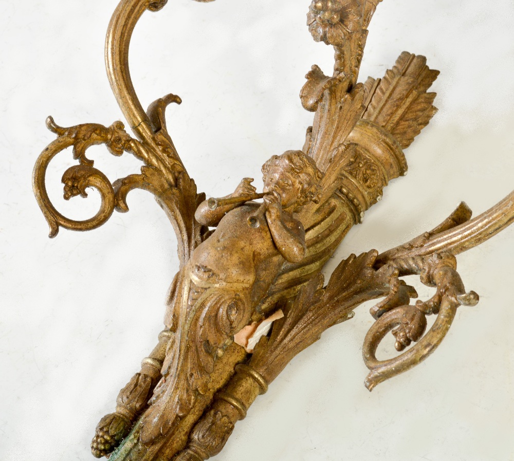 A pair of late 19th century gilt metal three light wall sconces, each cast with a cherub playing - Image 3 of 3