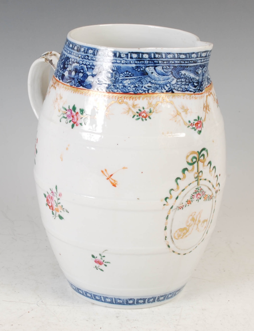 A Chinese porcelain blue and white barrel shaped jug, Qing Dynasty, decorated with ribbon tied