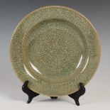A Chinese porcelain celadon ground crackle glaze dish, four character Chengua mark but later, 24cm