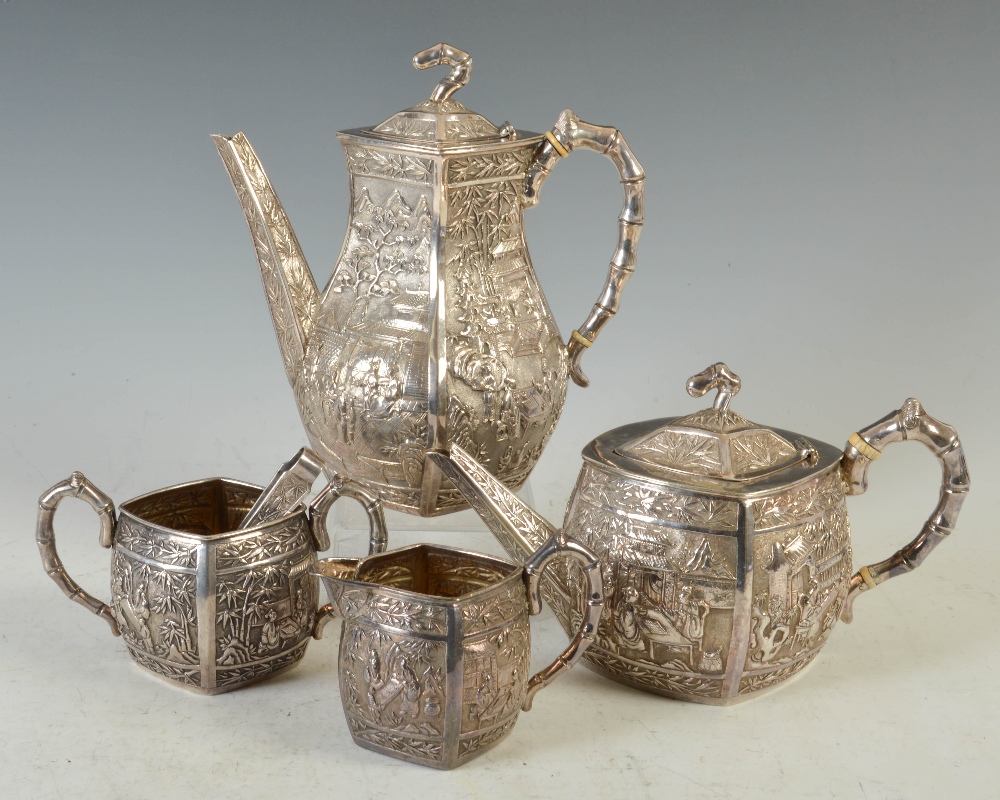A late 19th century Chinese silver four piece tea and coffee set, WANG HING, lozenge shaped with