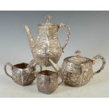 A late 19th century Chinese silver four piece tea and coffee set, WANG HING, lozenge shaped with