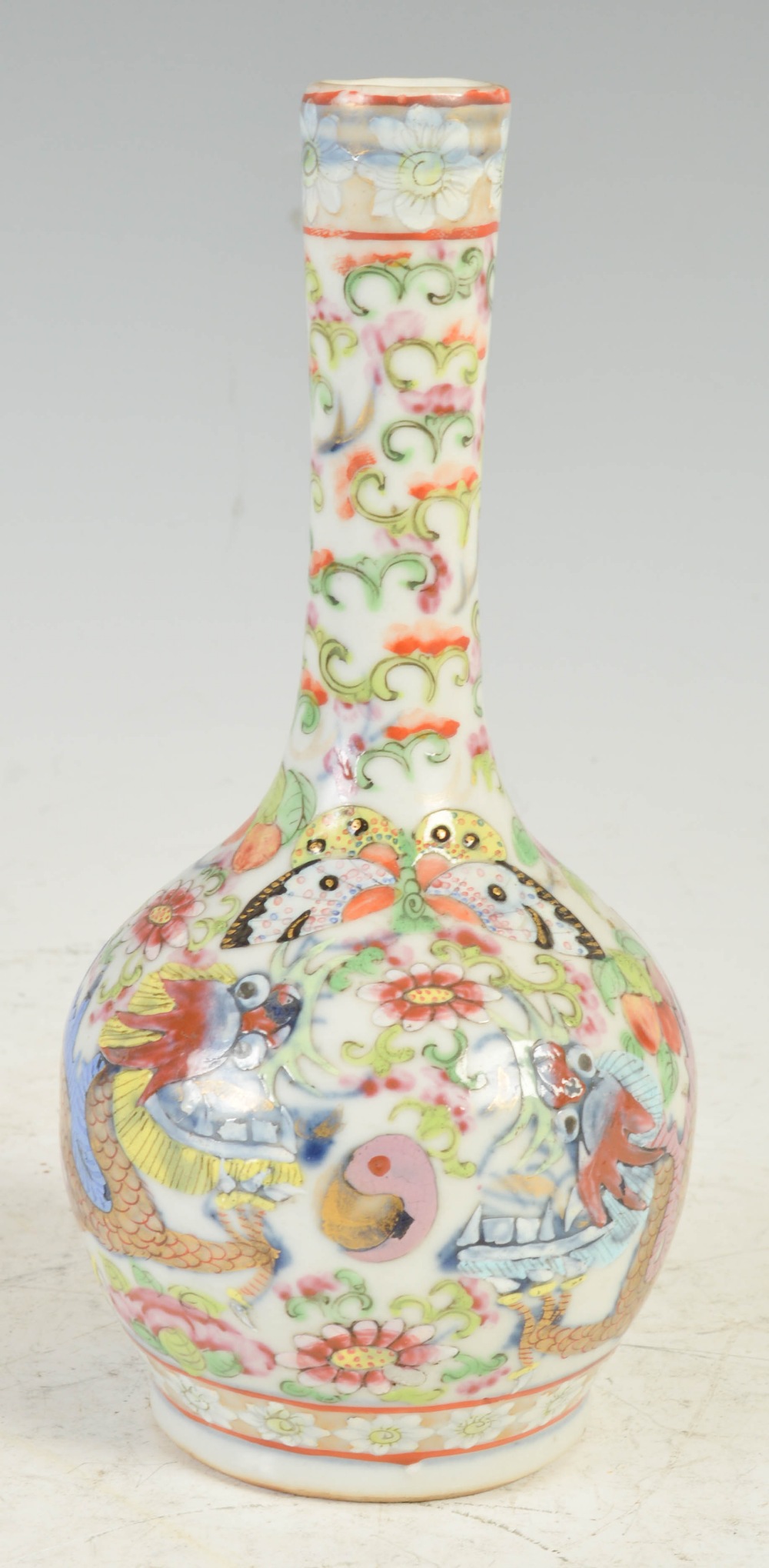 A Chinese porcelain Canton famille rose bottle vase, Qing Dynasty, decorated with a pair of