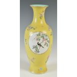 A Chinese porcelain yellow ground famille rose vase, bearing Qianlong seal mark but later, decorated