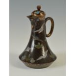 A Japanese black ground cloisonne enamel ewer and cover, late 19th/ early 20th century, decorated