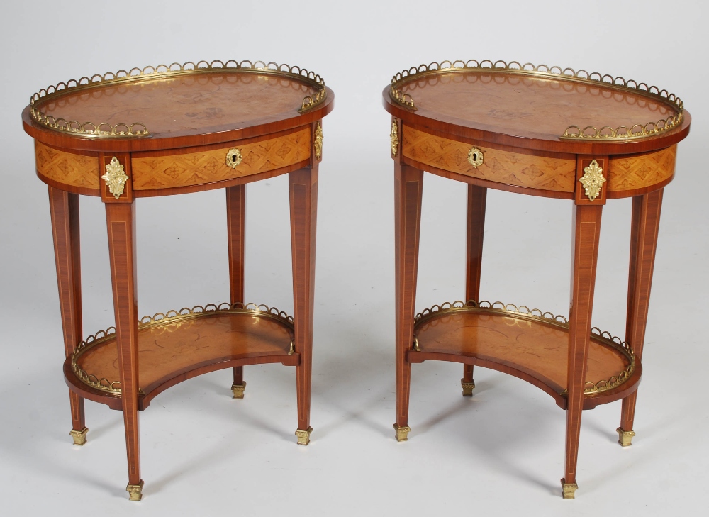 A pair of 20th century rosewood, marquetry and gilt metal mounted occasional tables, the oval-shaped
