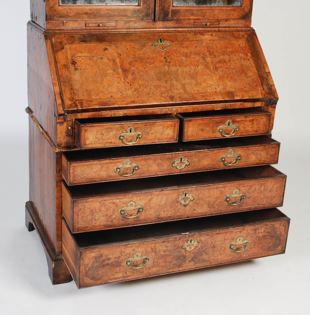 A George III walnut bureau bookcase, the moulded cornice above a pair of mirrored cupboard doors, - Image 4 of 14